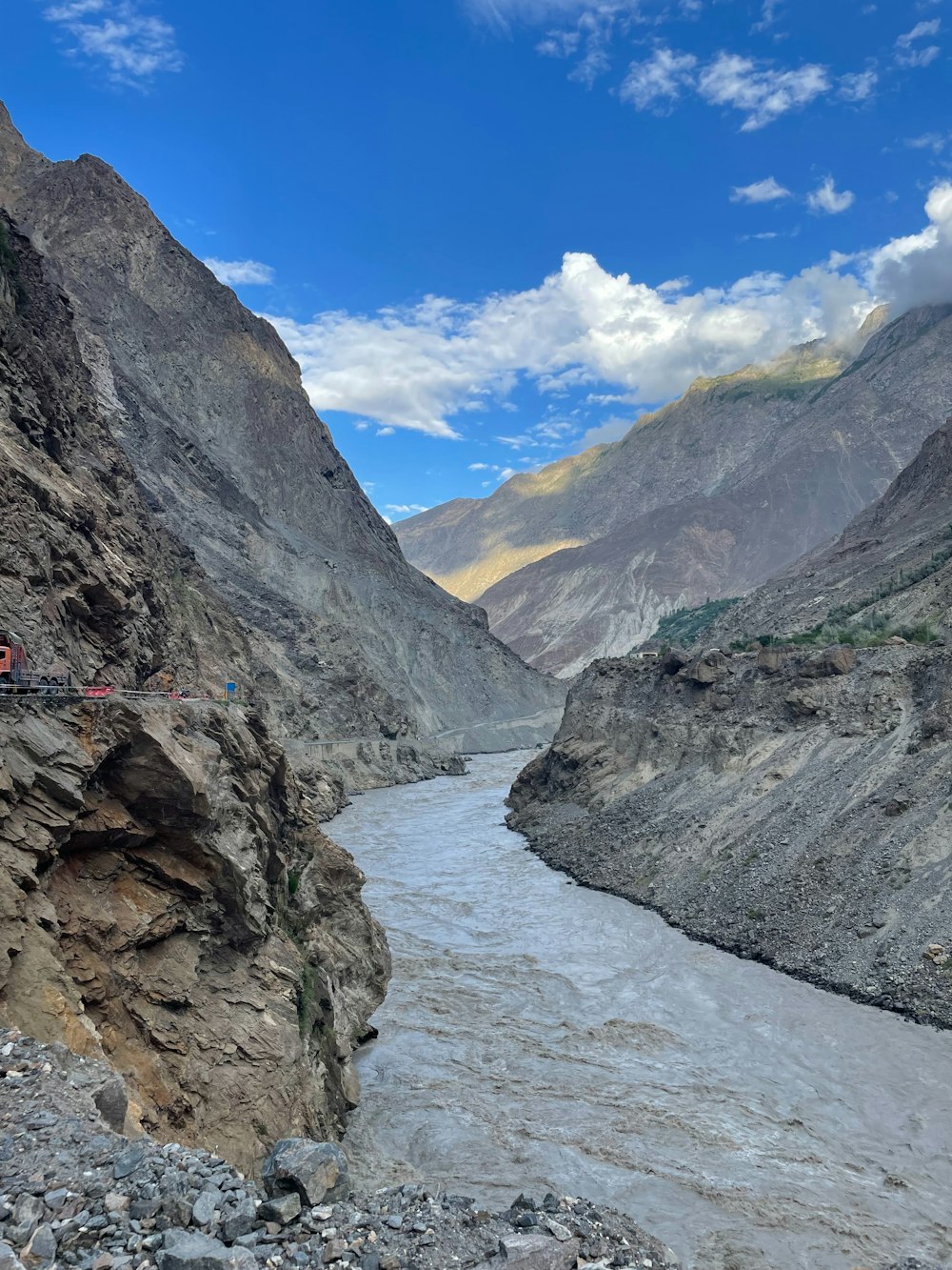 a train traveling through a canyon next to a river