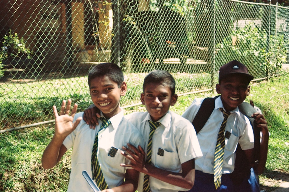 a group of young boys standing next to each other