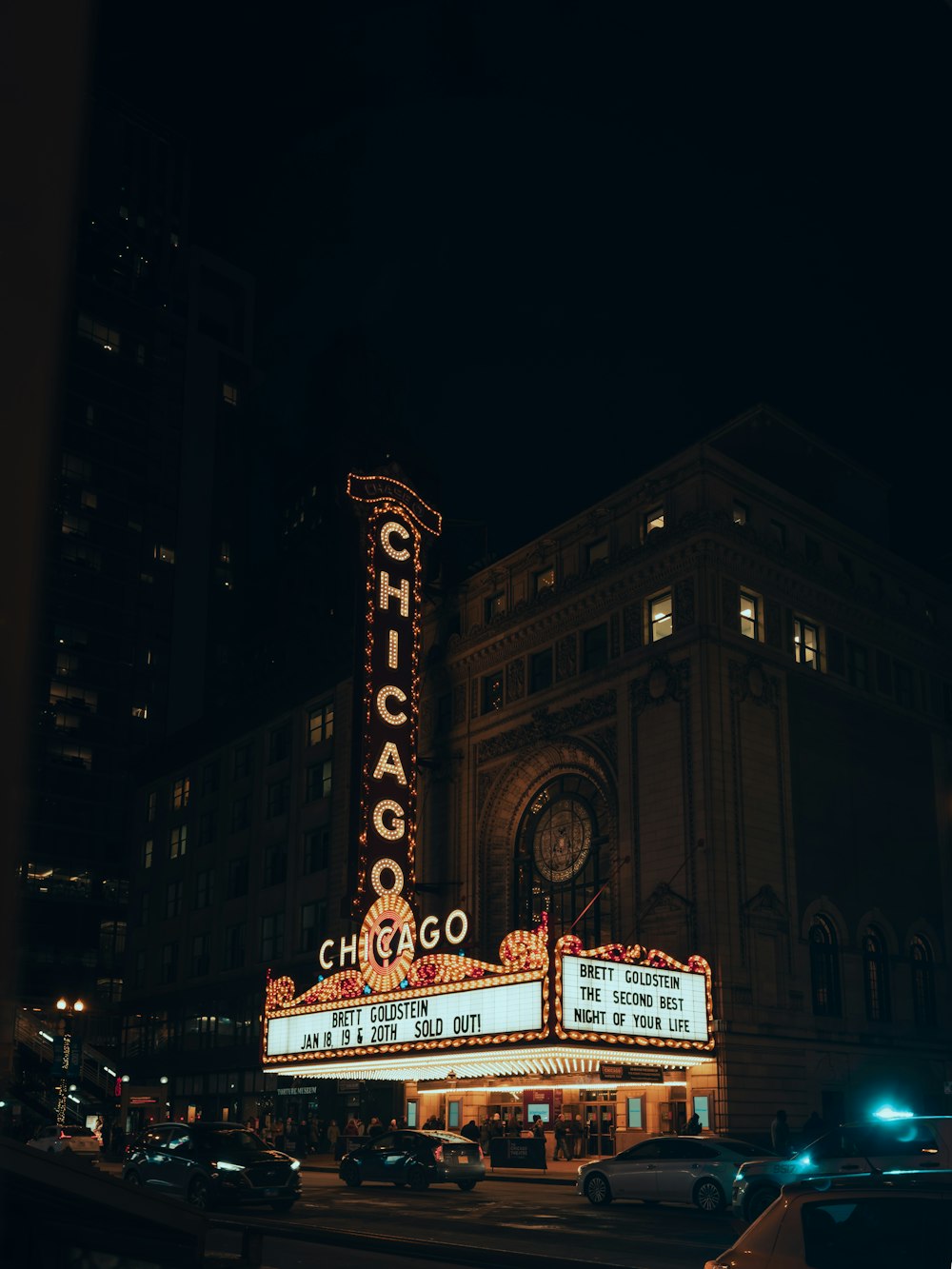 a theater marquee lit up at night