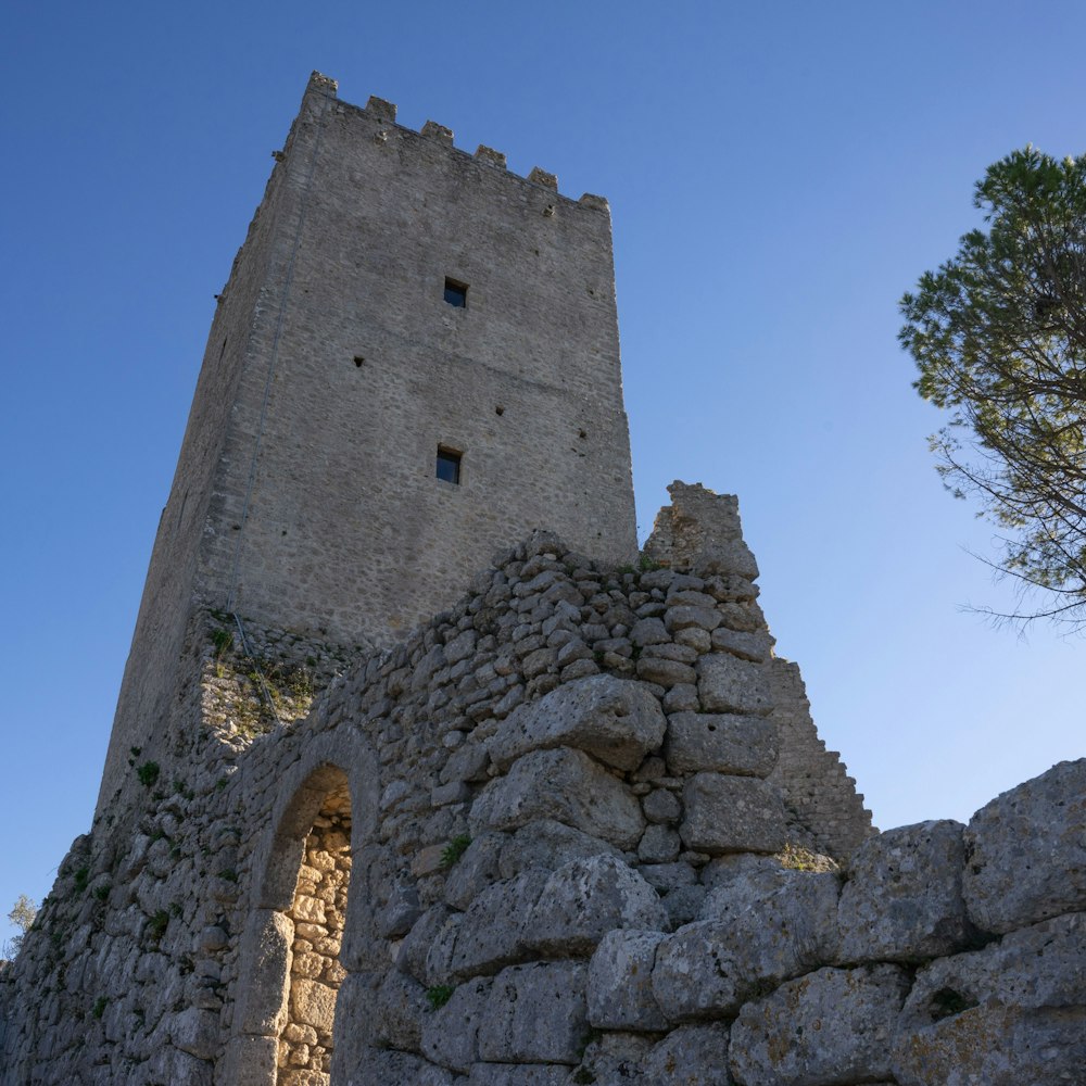 a stone tower with a door in the middle of it