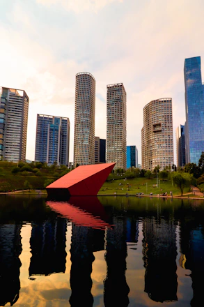a large red object floating on top of a body of water