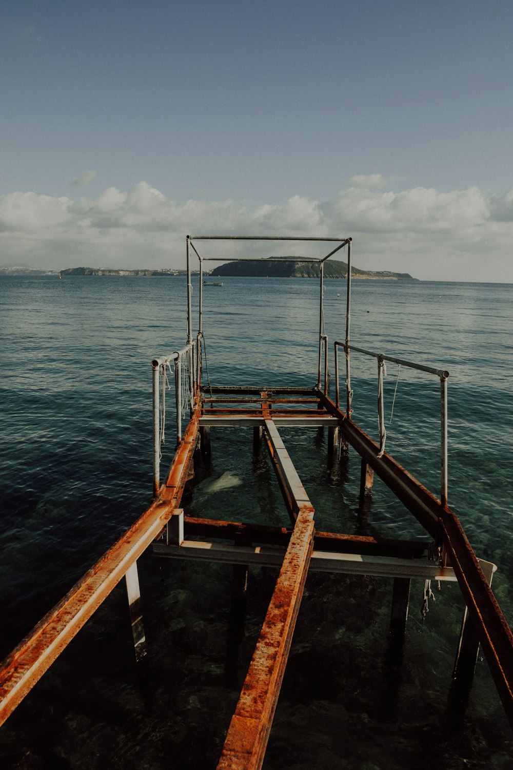 a boat dock in the middle of a body of water