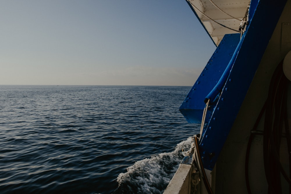 a view of the ocean from the back of a boat