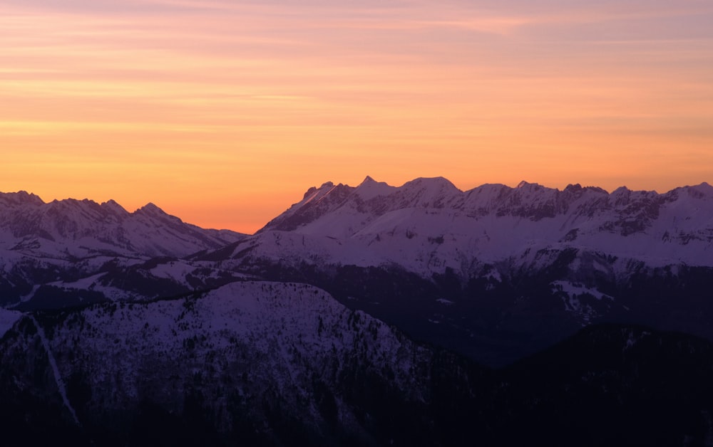 a view of a mountain range at sunset