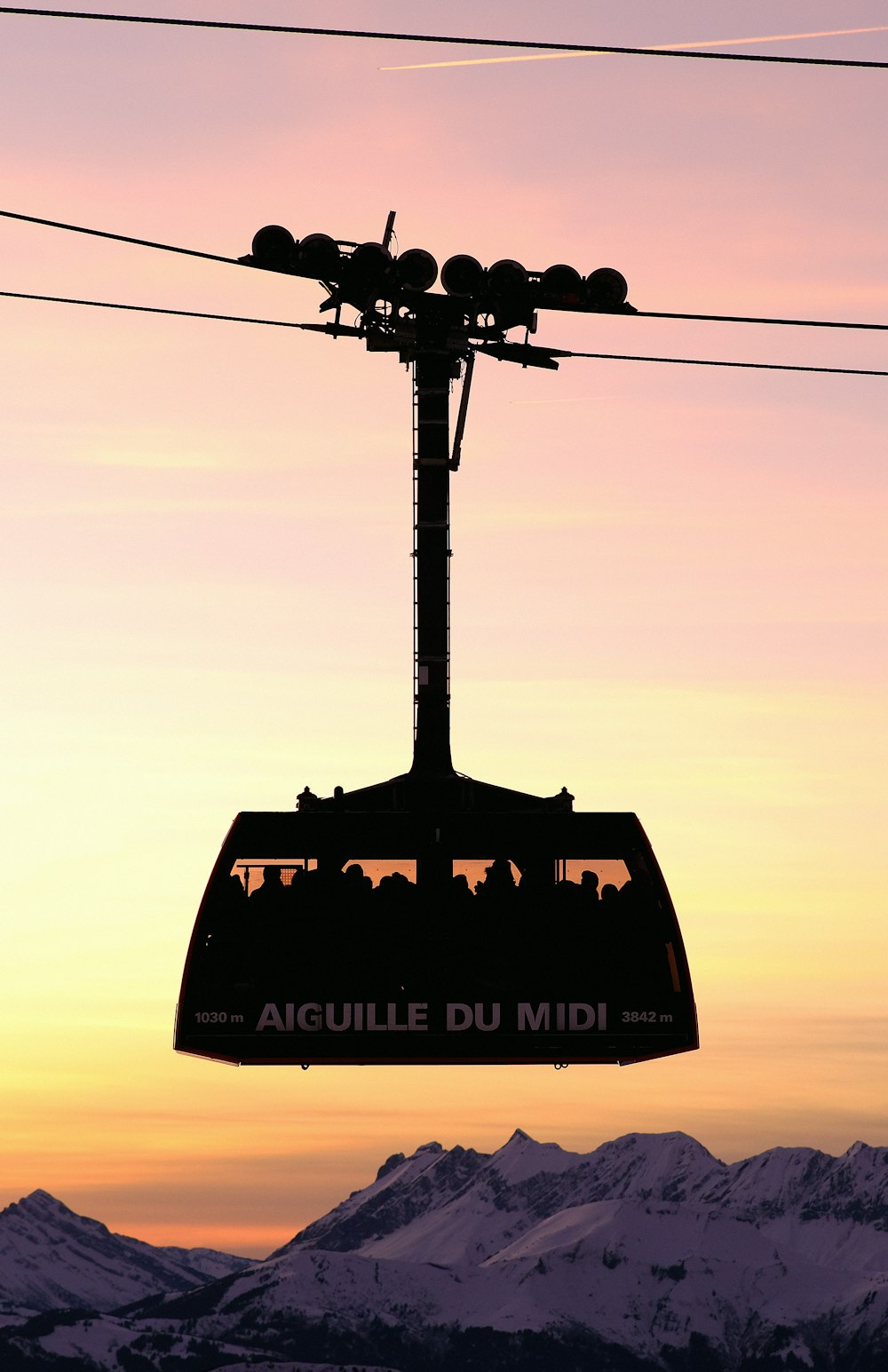 a ski lift with a sky in the background