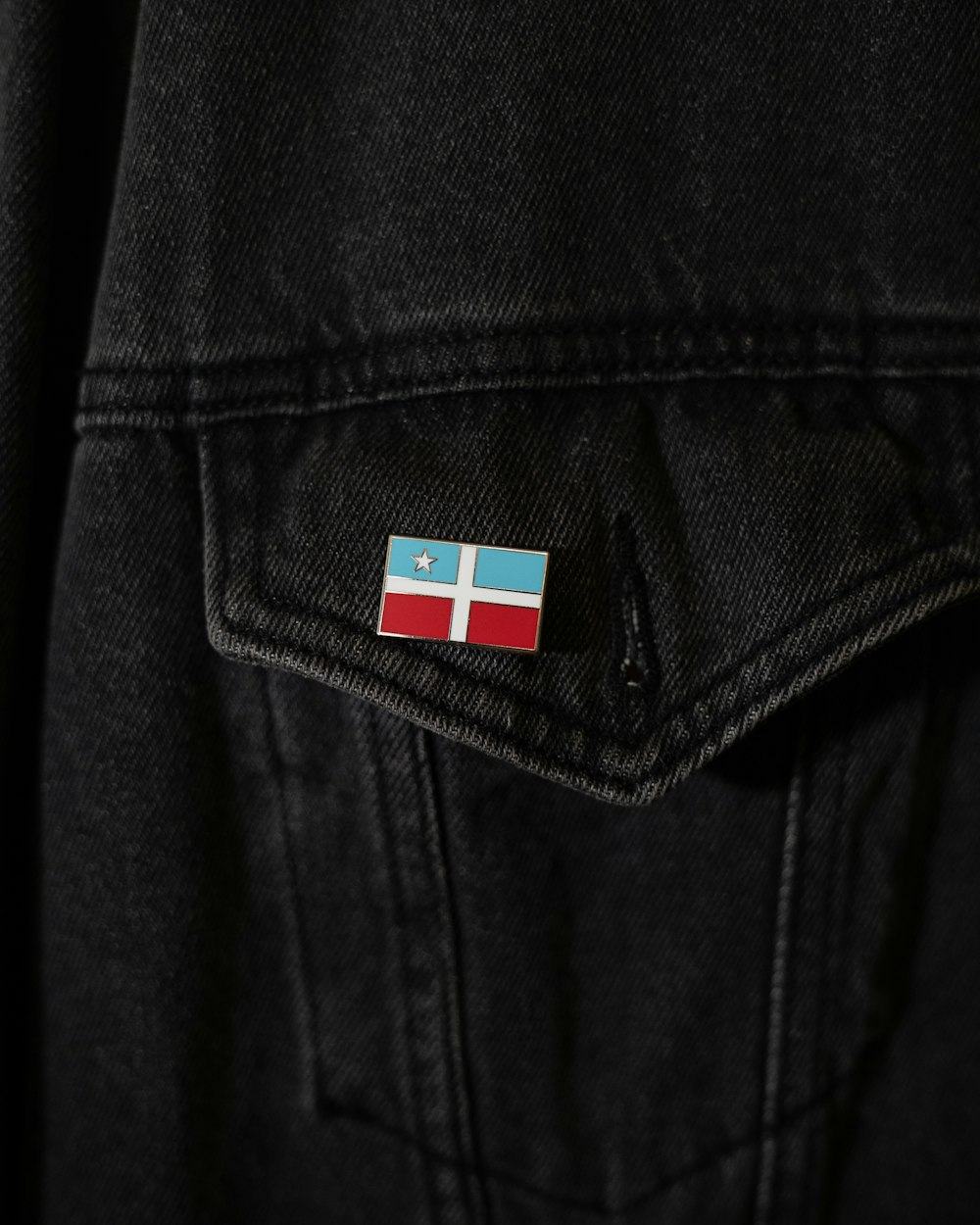 a jacket with a flag on the back of it