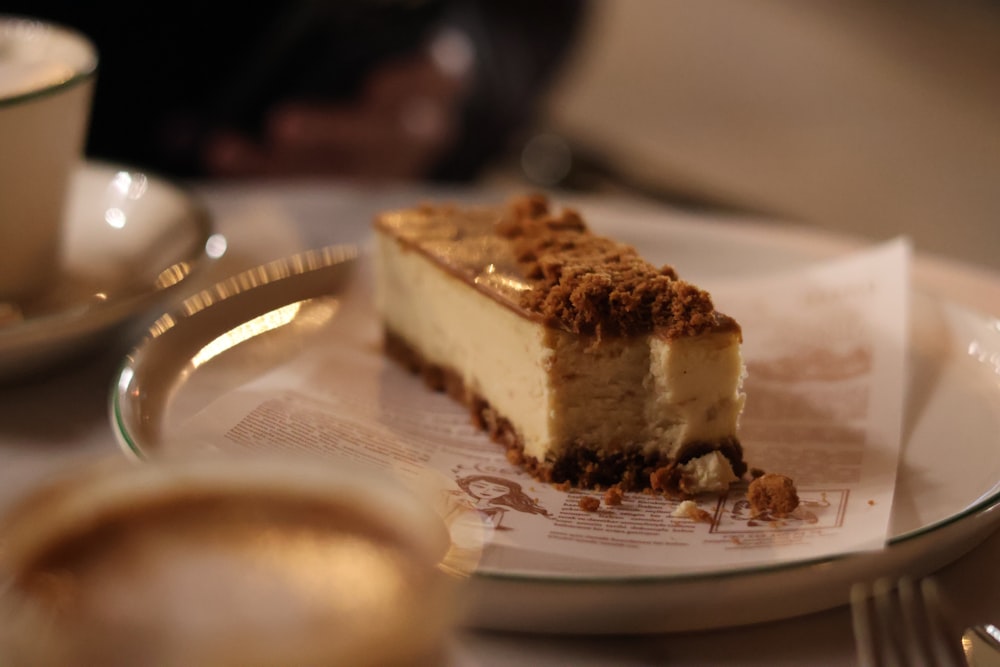 a piece of cheesecake sitting on top of a white plate