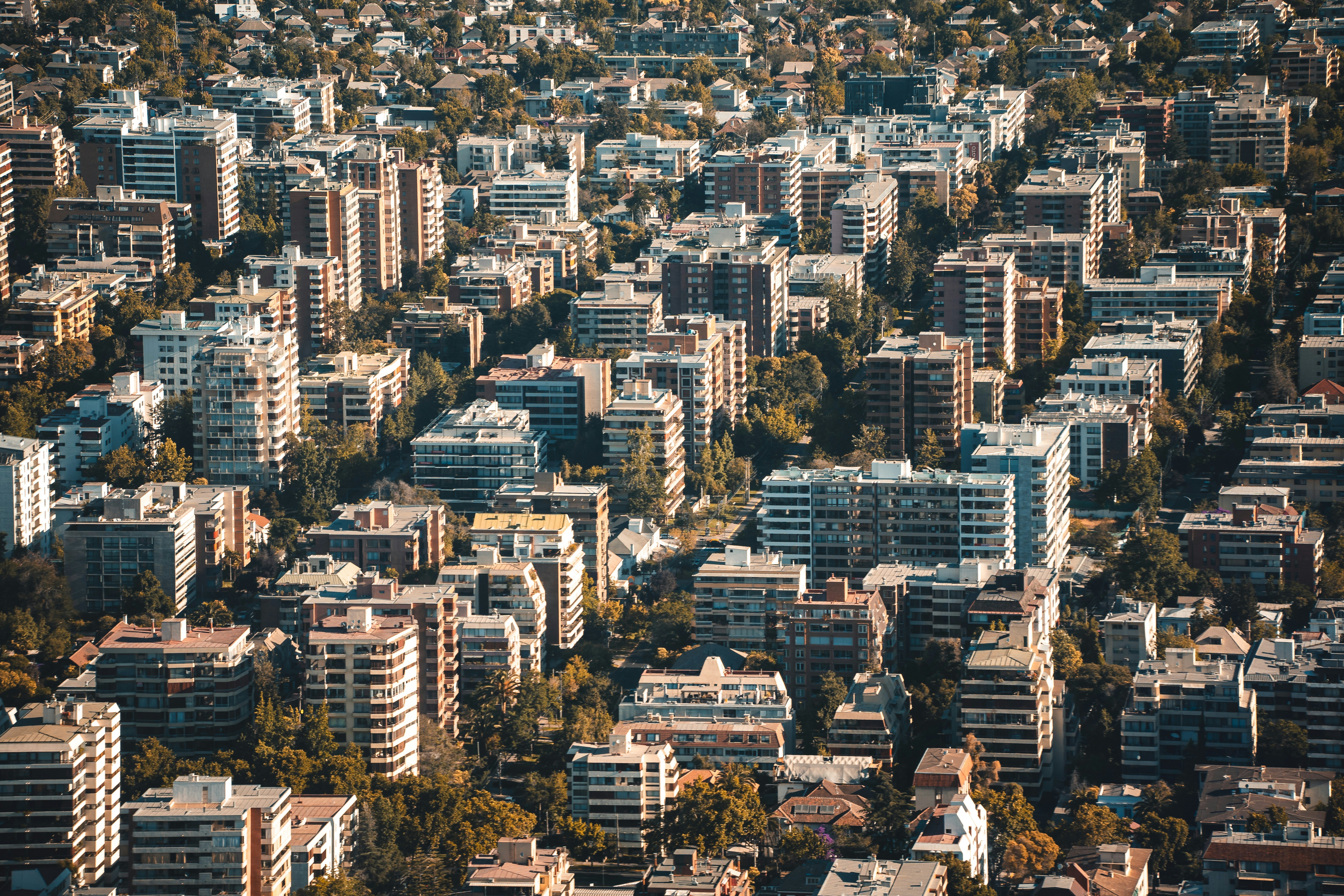 an aerial view of a city with tall buildings