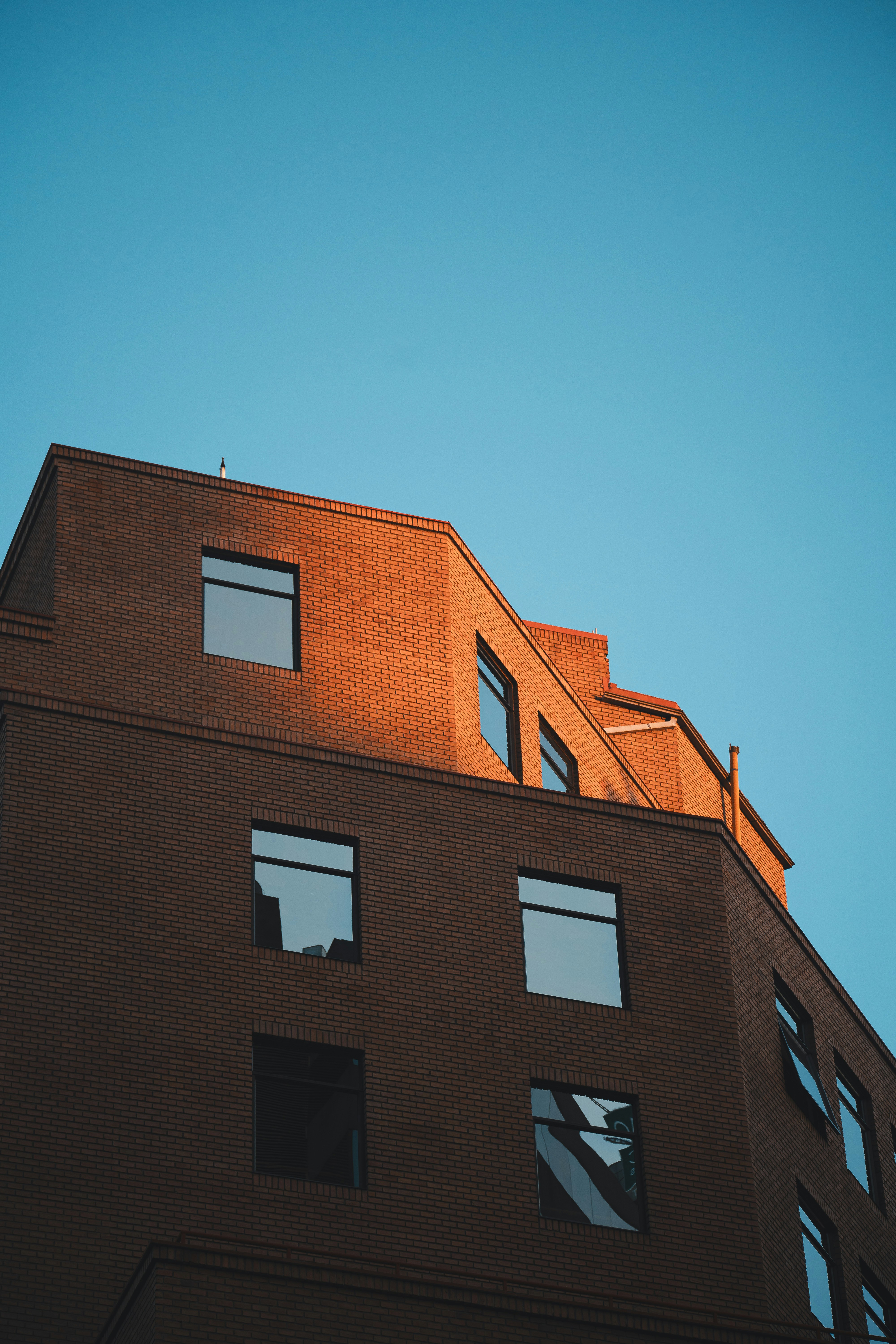 a tall brick building with lots of windows