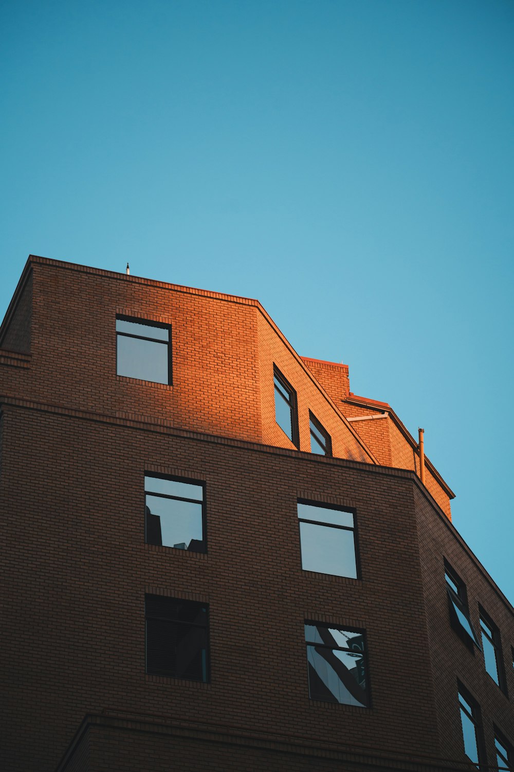 a tall brick building with lots of windows