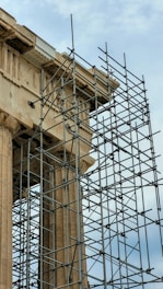 a clock tower with scaffolding around it