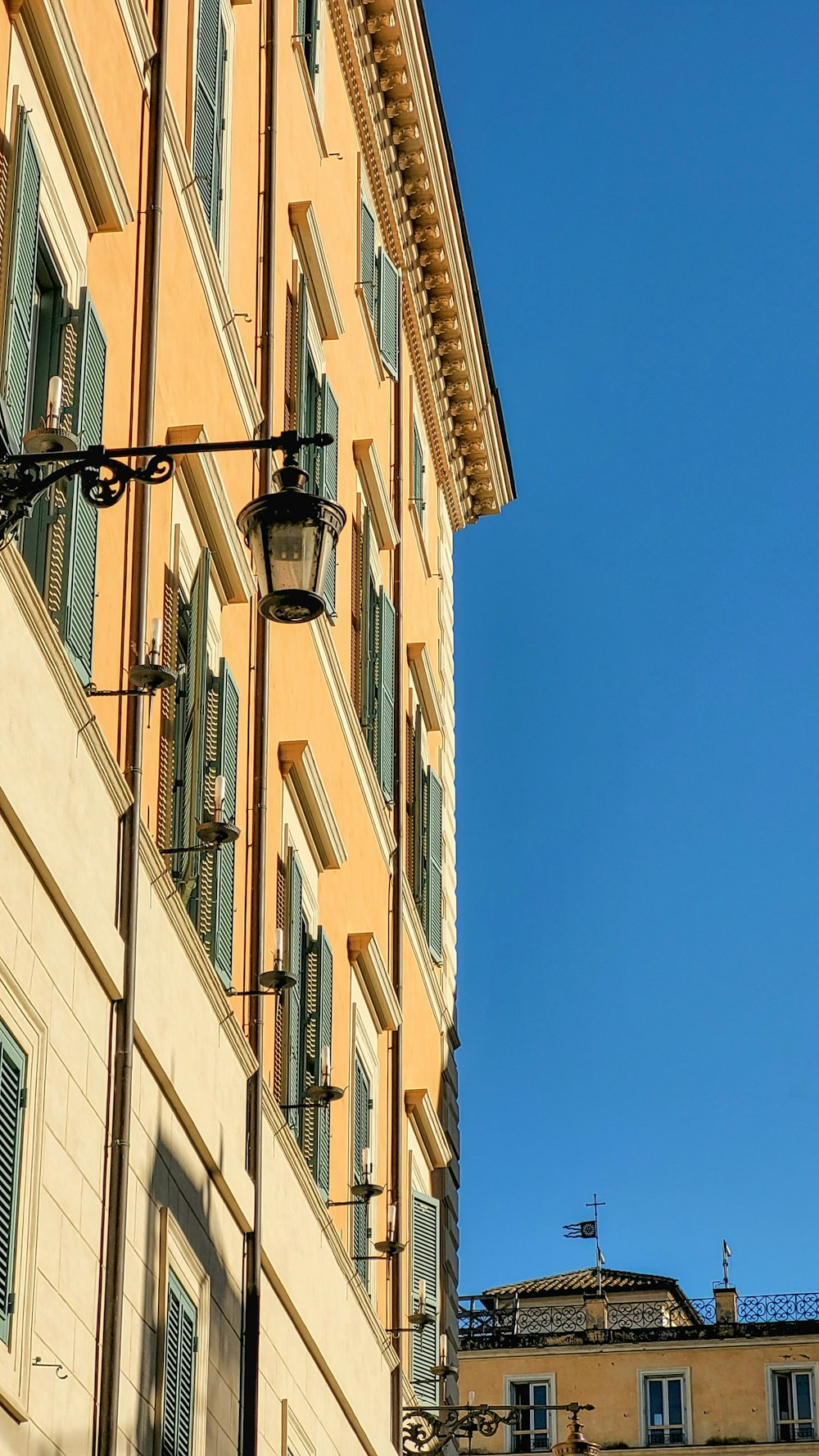 a street light hanging from the side of a building