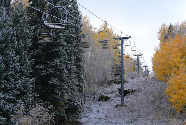 Ski lift climbing a snowy slope at Telluride