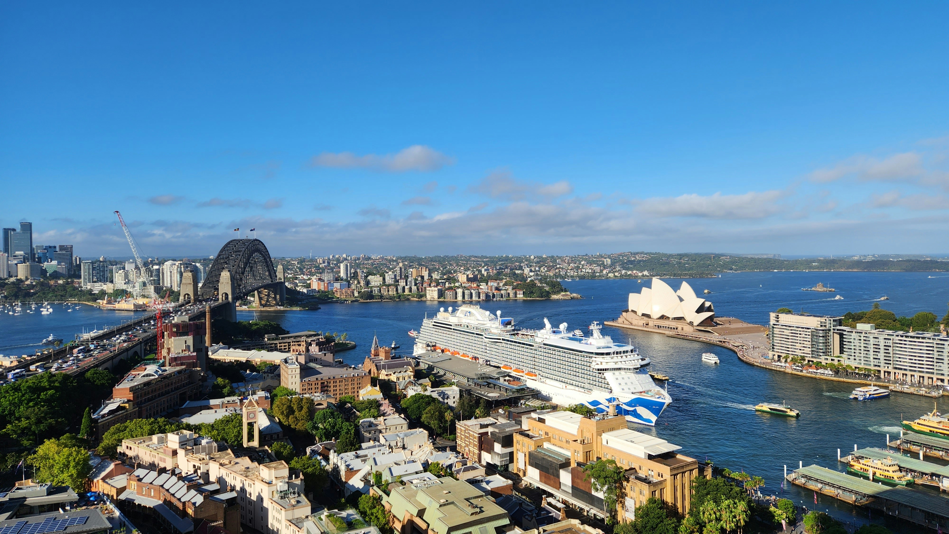 a cruise ship in the water near a city