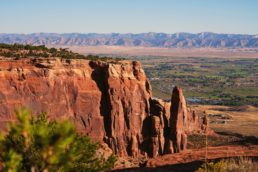 a scenic view of a valley and mountains