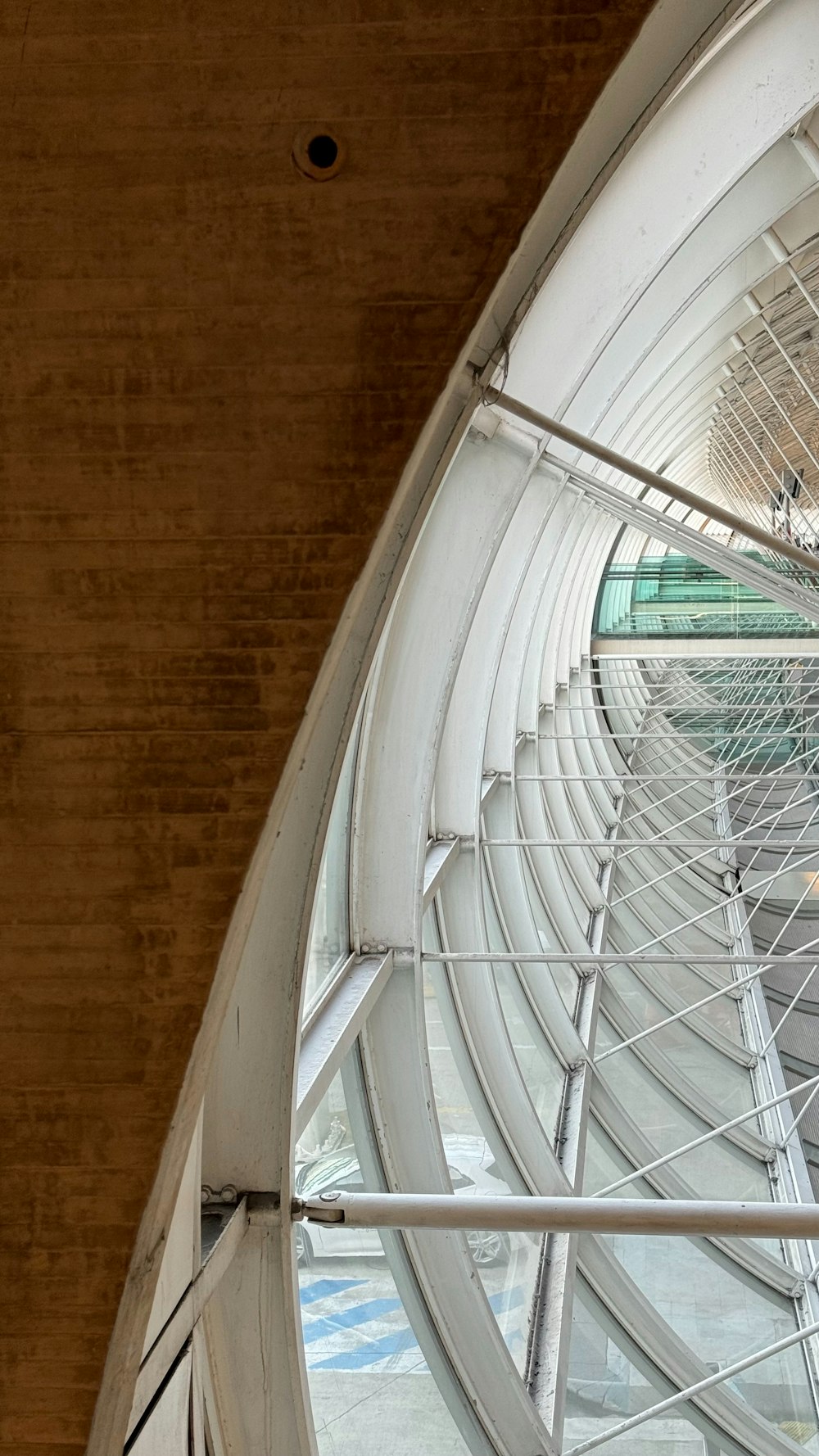 a large circular window with a clock on the side of it