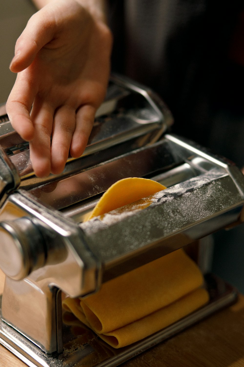 a person using a pasta cutter to make a pasta