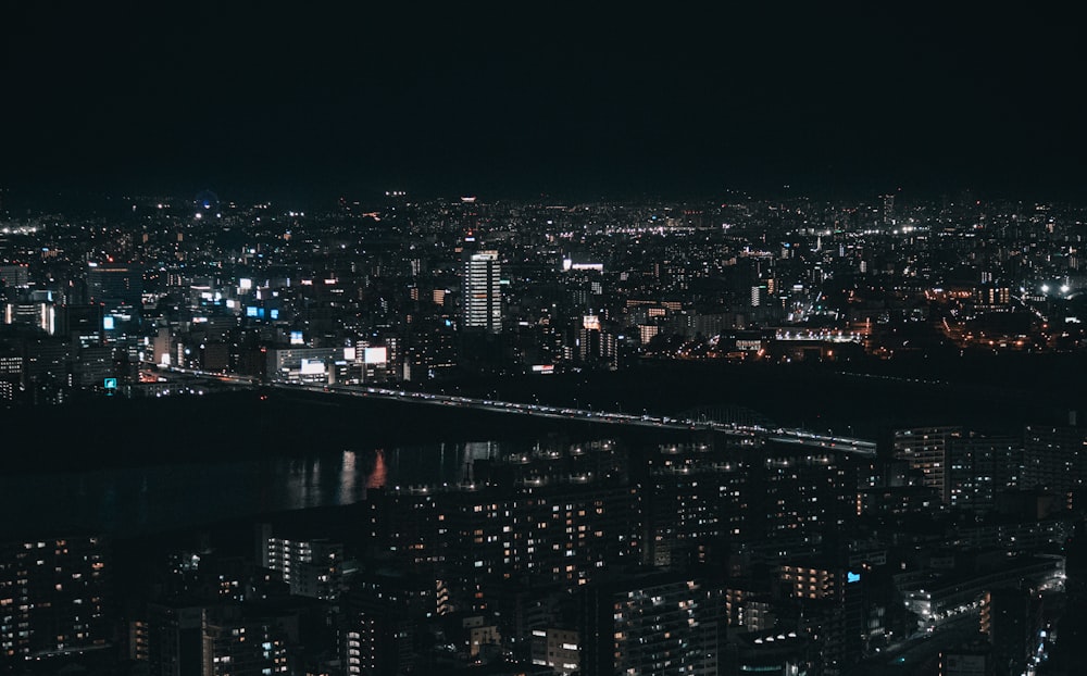 a view of a city at night from the top of a building