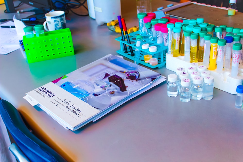 a table topped with lots of bottles of liquid