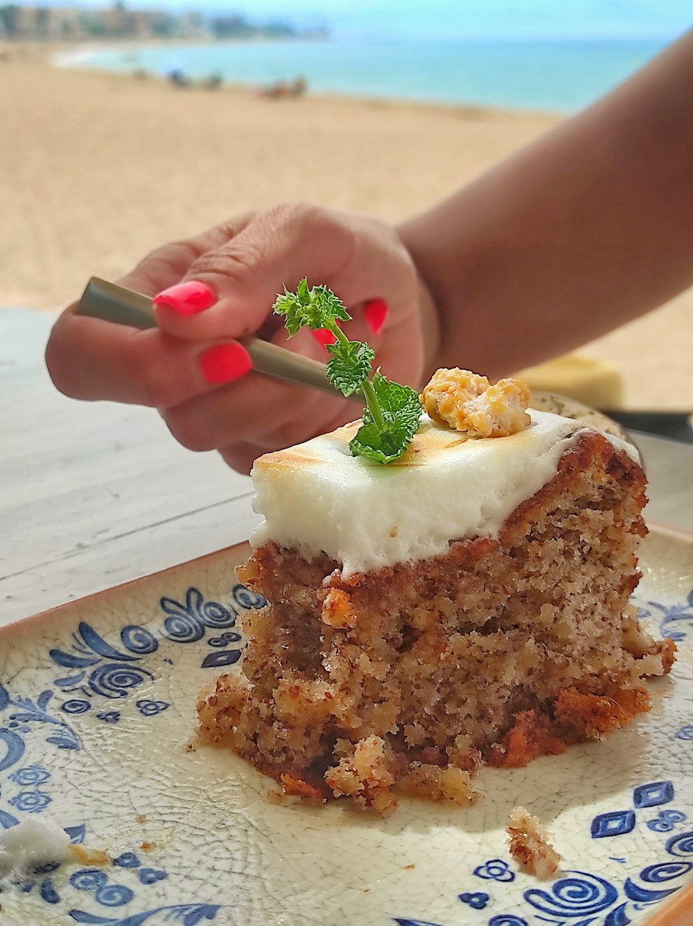 a piece of cake on a blue and white plate