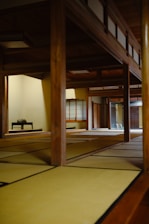 an empty room with a bench in the middle of it