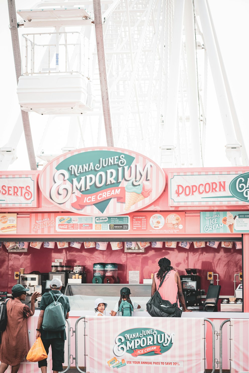 a group of people standing around a food stand