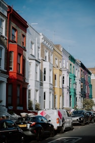 a row of multi - colored buildings on a city street