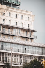 a tall building with balconies on top of it