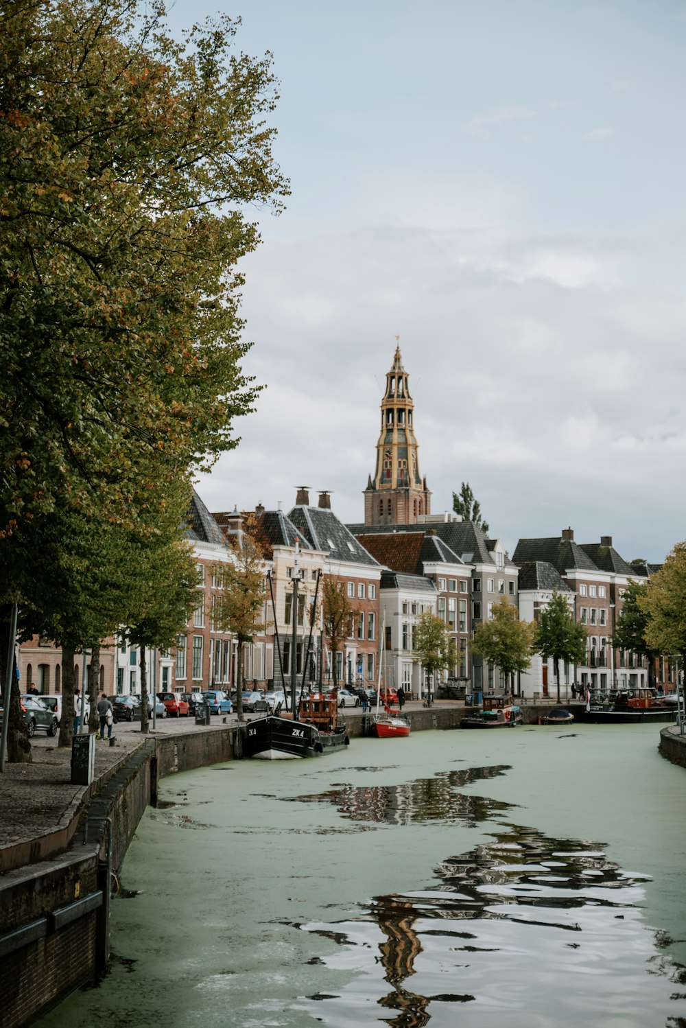 a river running through a city next to tall buildings