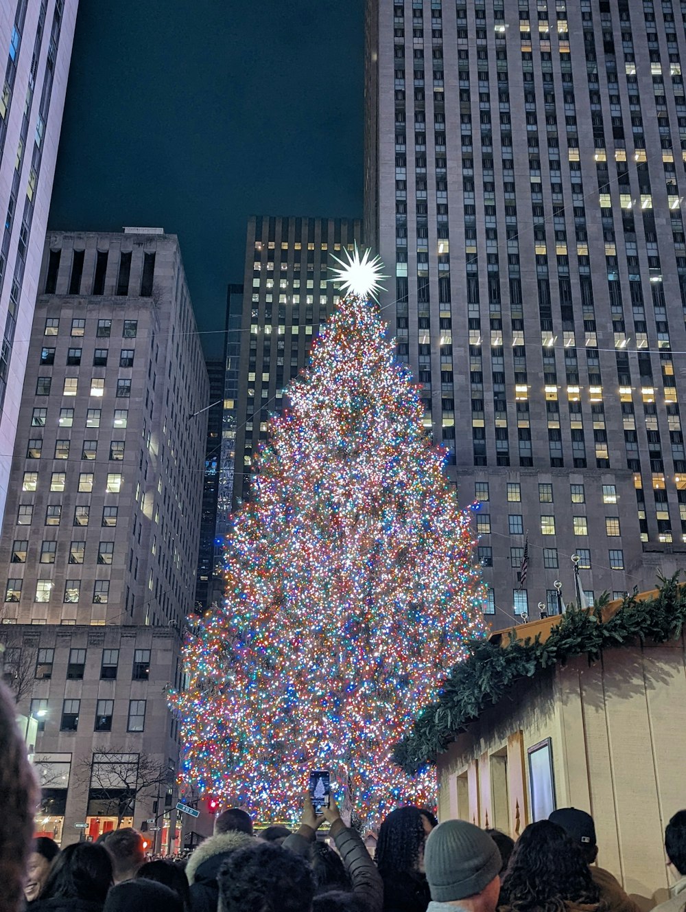 a large christmas tree in the middle of a city