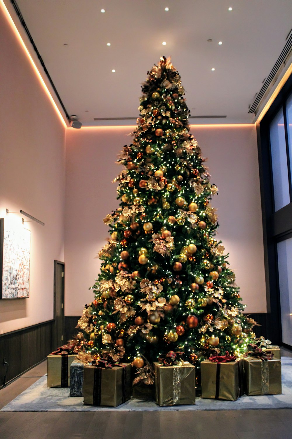 a large christmas tree in a large room