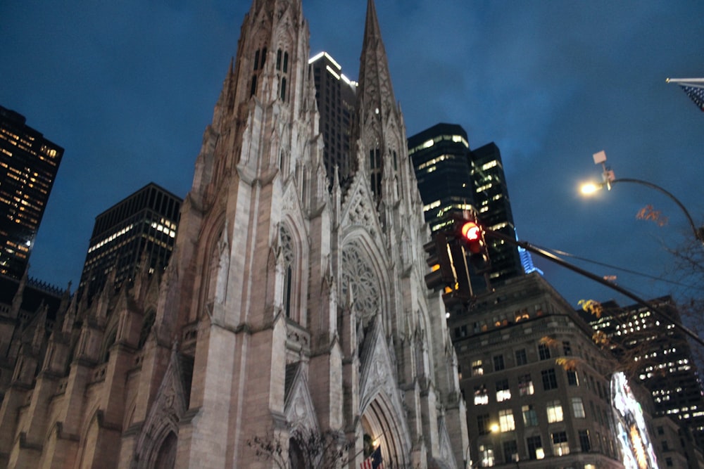 a large cathedral in a city at night