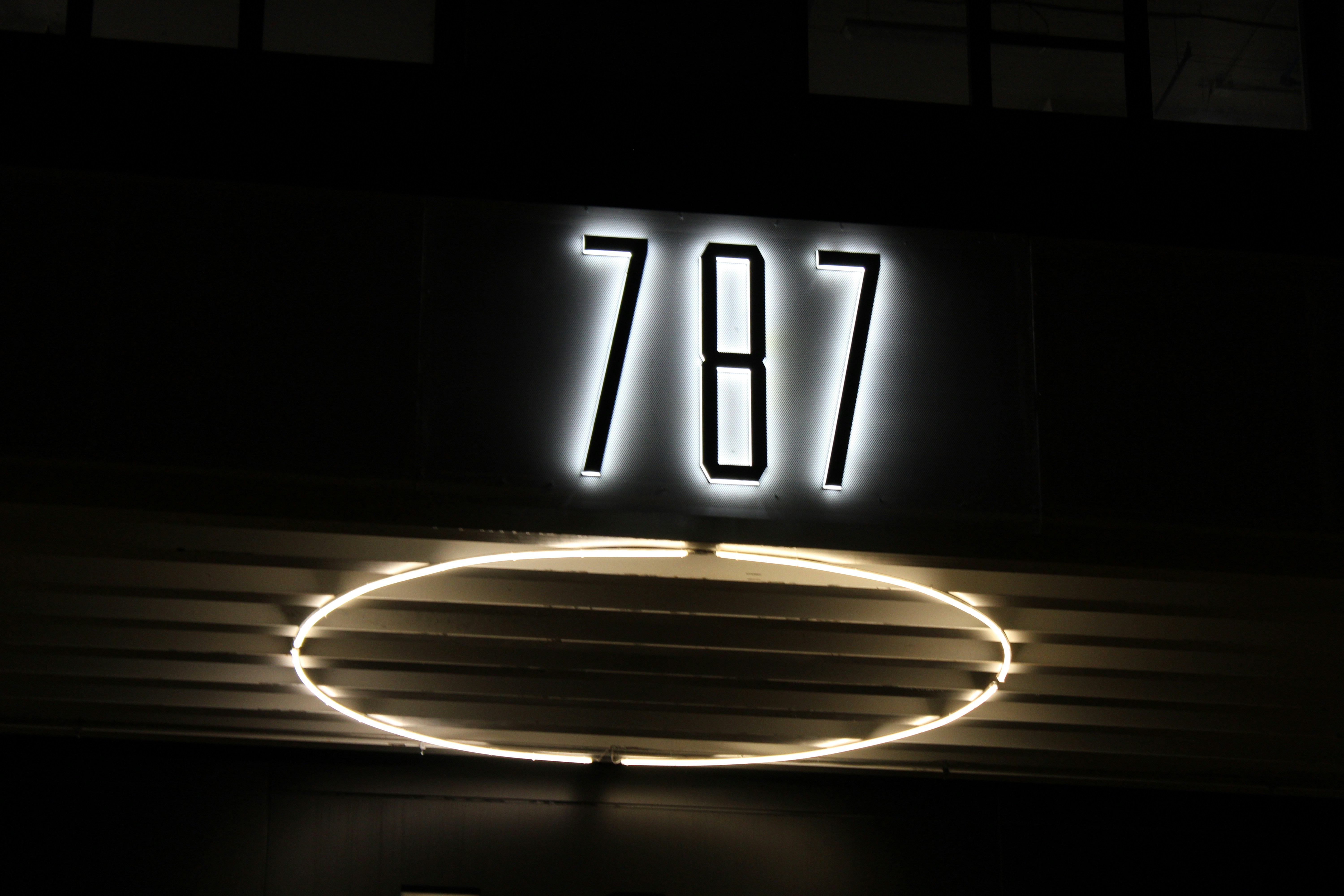 a neon sign with the number seventy on it
