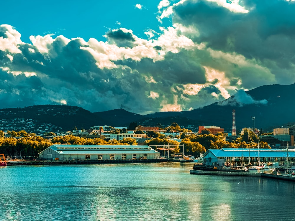 a body of water with a city in the background