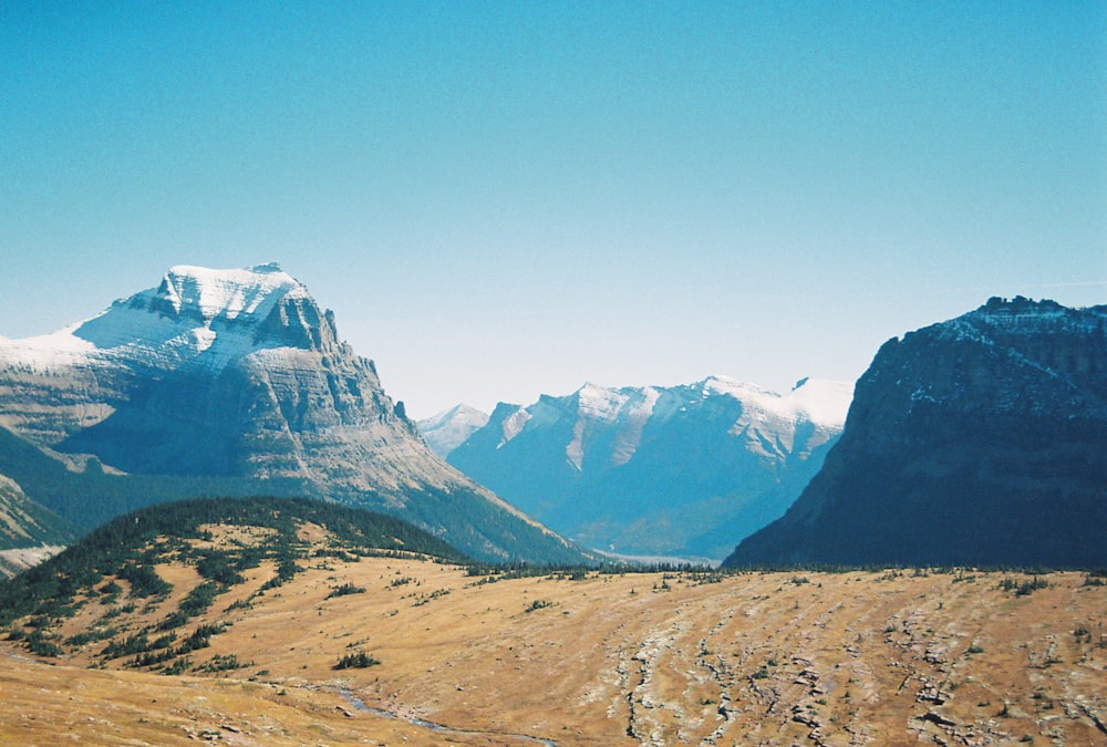 a view of a mountain range with a river running through it