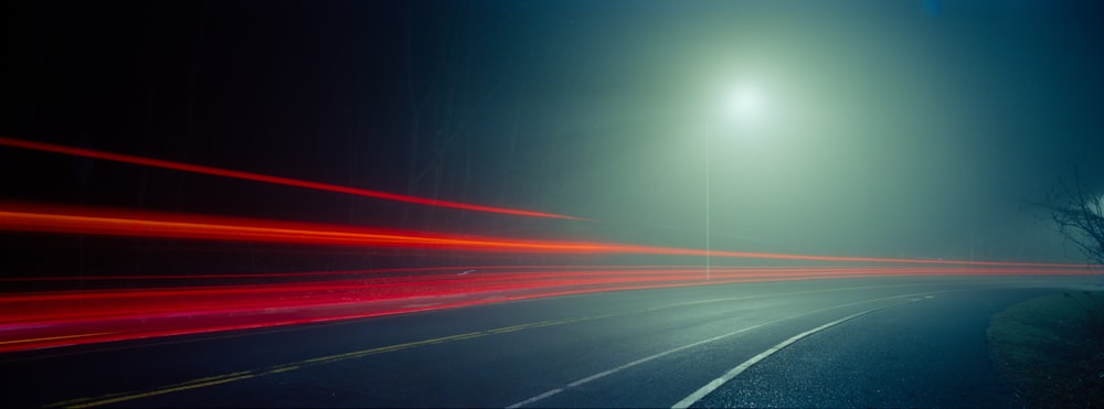 a long exposure photo of a street at night