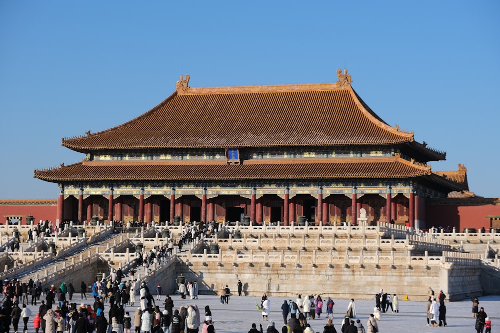 a group of people standing in front of a building