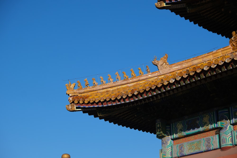 the roof of a building with a statue on top of it