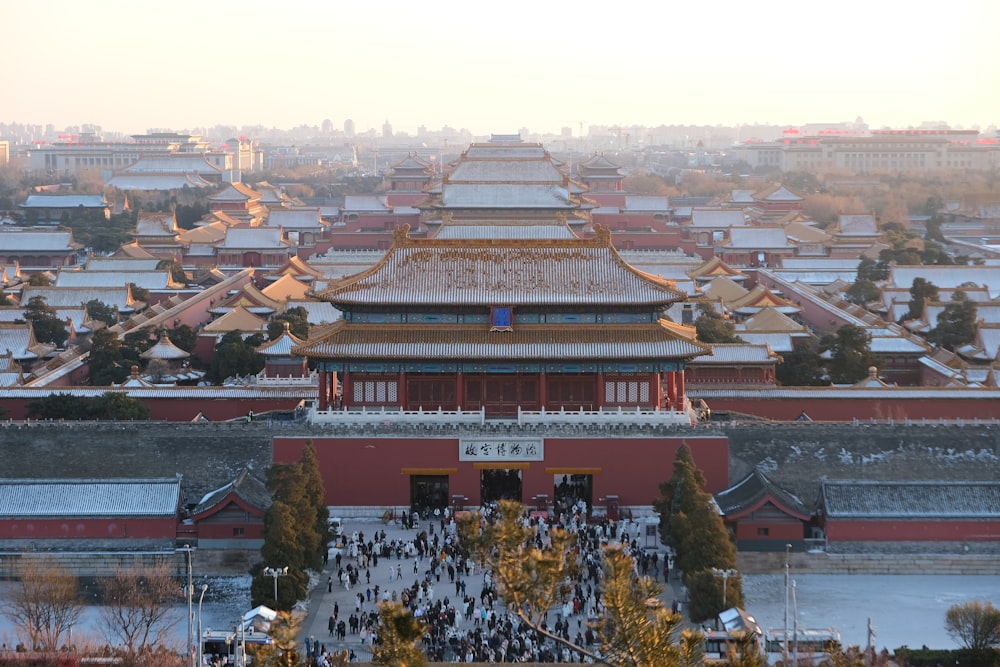 a large building with a lot of people walking around it