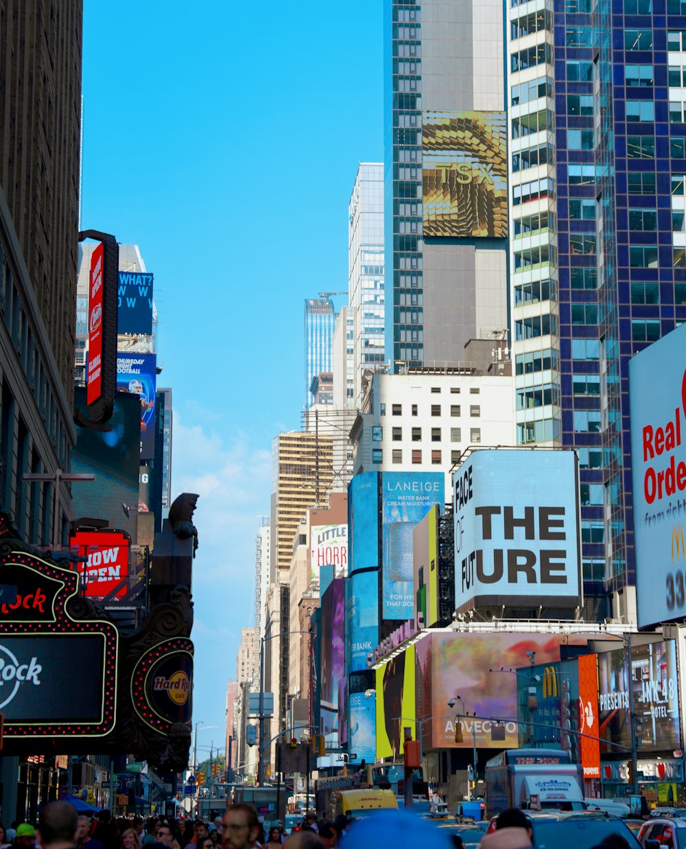 a city street filled with lots of tall buildings