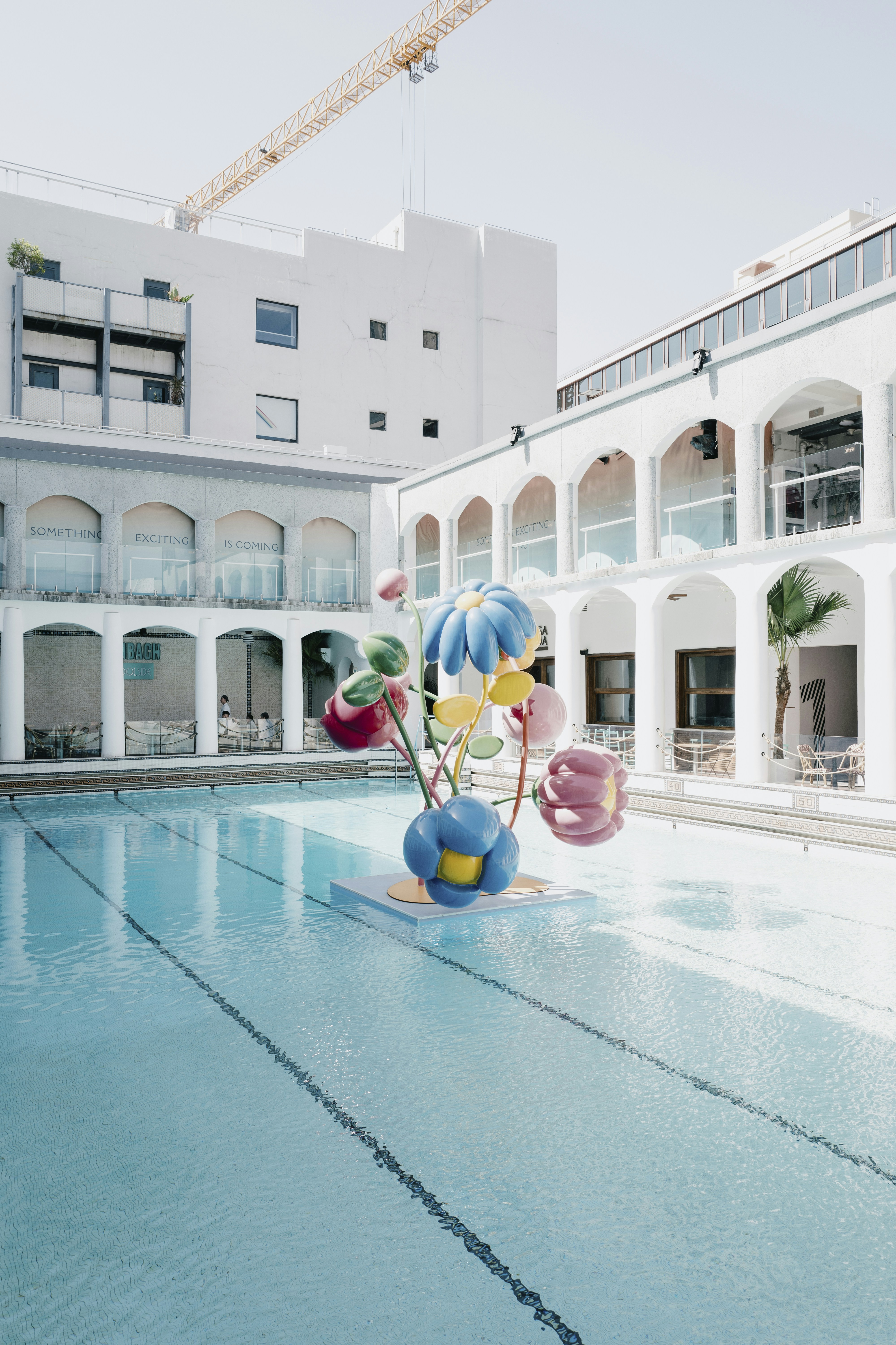 woman wearing yellow long-sleeved dress under white clouds and blue sky during daytime