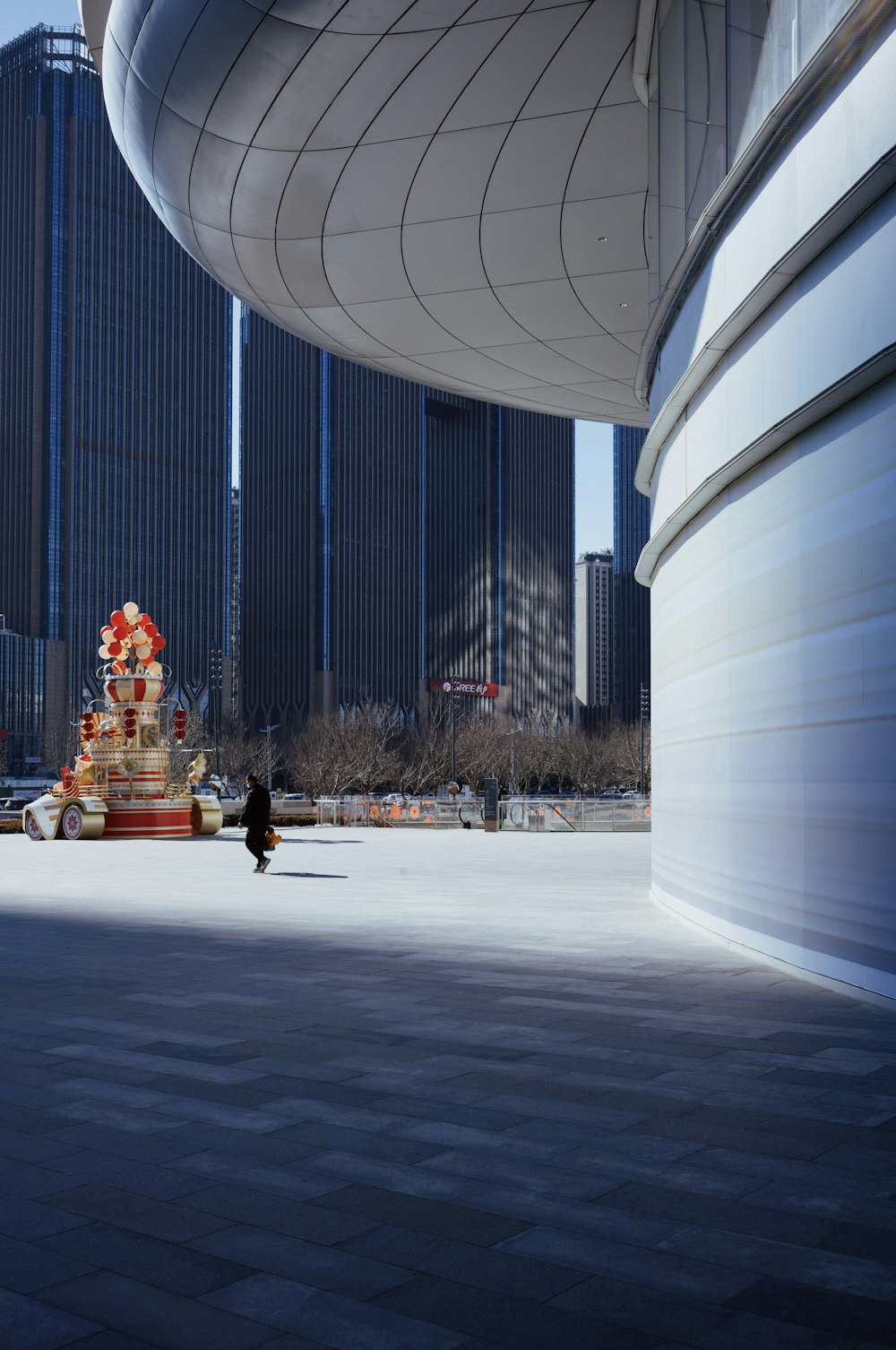 a person standing in front of a tall building