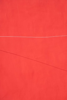 a red wall with a white line on it