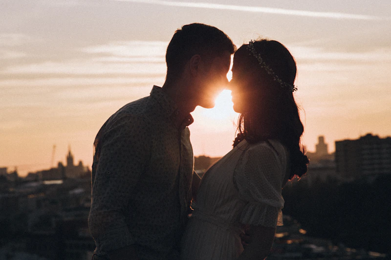 couple standing together at sunset