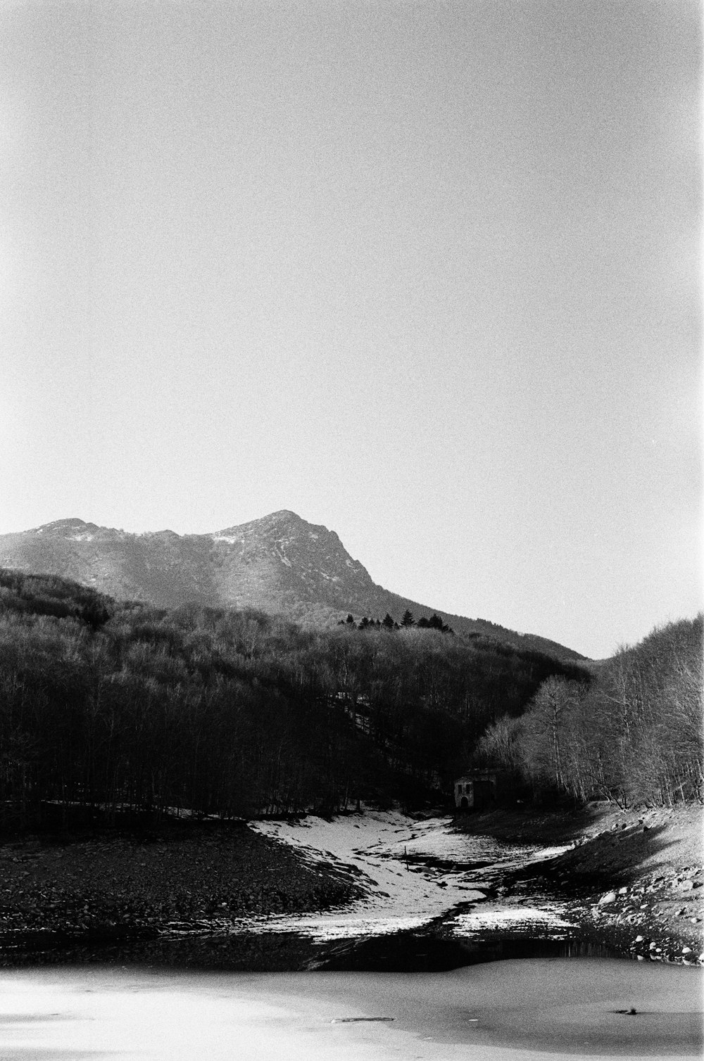 a black and white photo of a mountain range