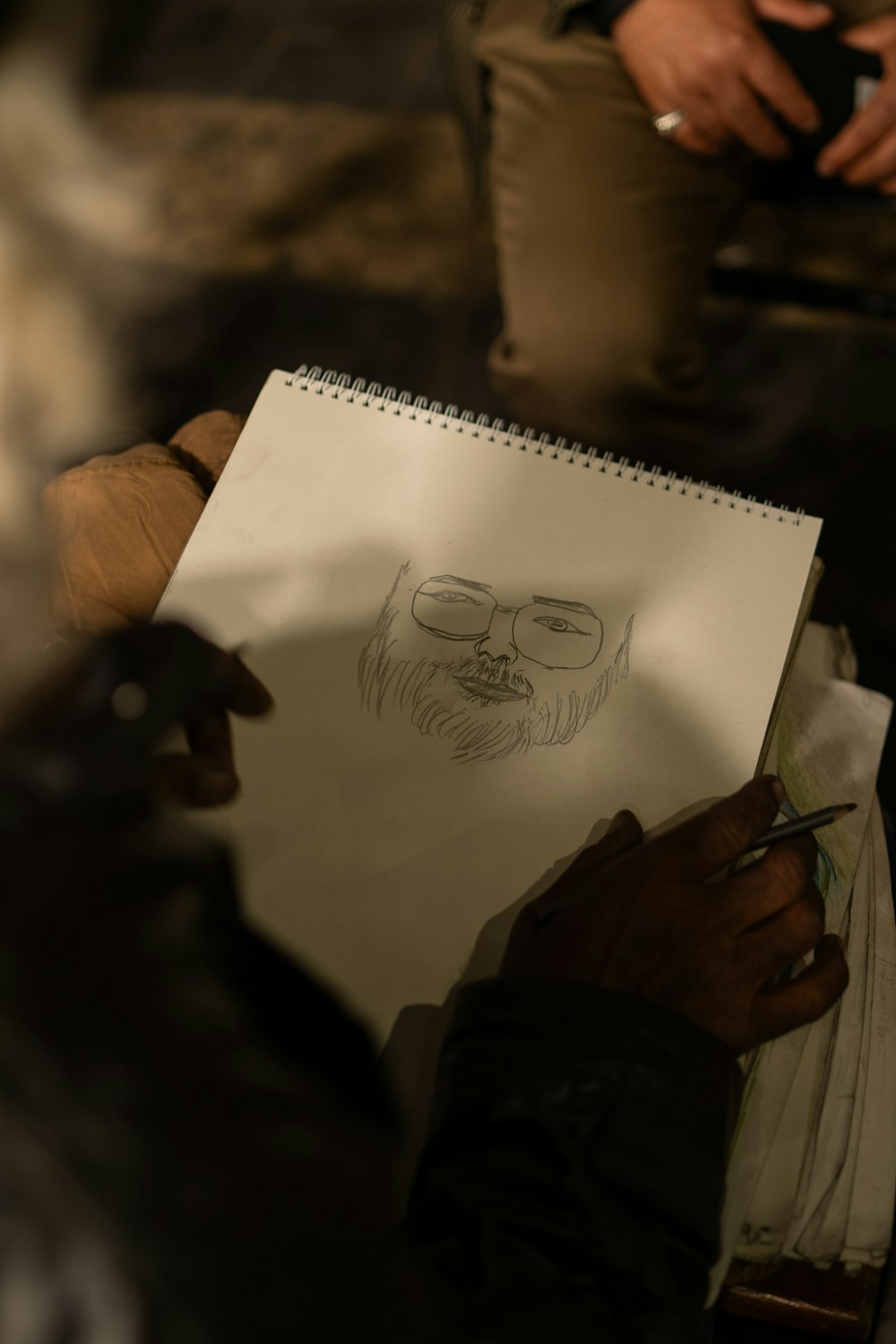 a drawing of a man's face on a piece of paper