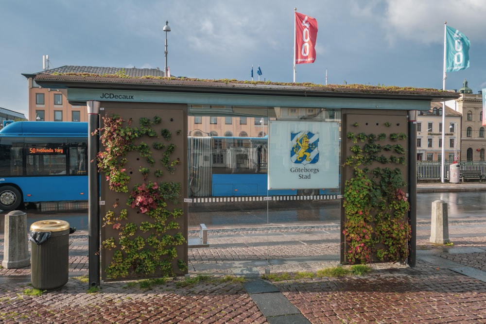 a bus stop with a bus parked in front of it