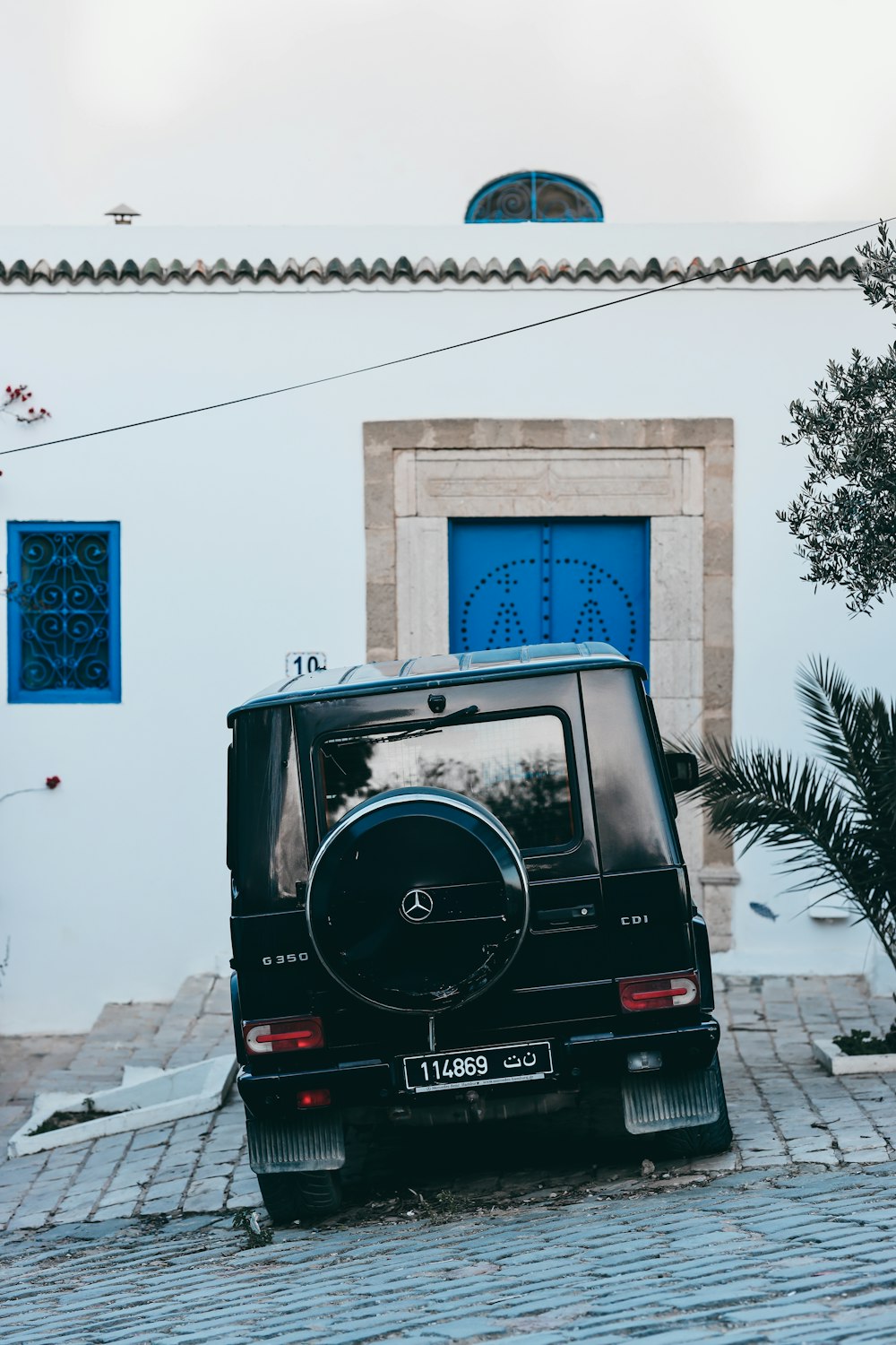 a black car parked in front of a building