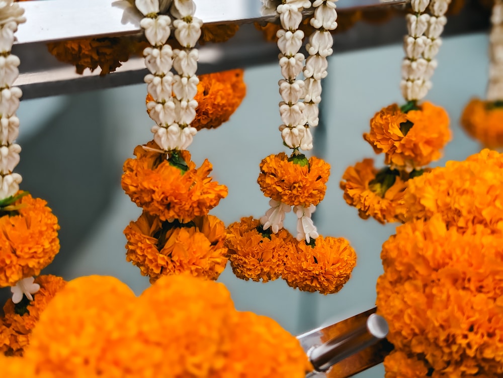 a bunch of flowers that are hanging from a rack