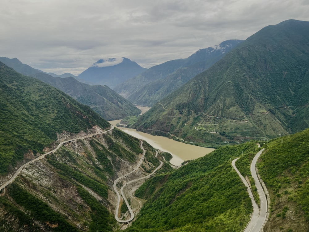 a view of a winding road in the mountains